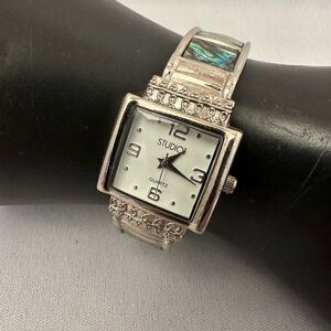 Studio clamper watch with abalone inserts